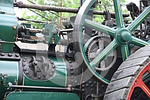 working steam engine with cogwheels and flywheel photo