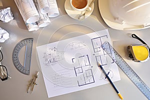 Working table of construction engineer with plan of project top