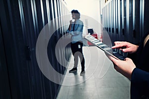 Working on tablet. server room