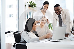 Working on their latest proposal. a group of diverse businesspeople having an informal meeting in their office.