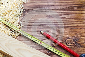 Working tool carpenter ruler, chisel, pencil, sawdust and shavings.