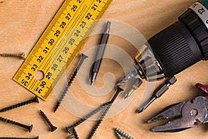 Working Tool on a Wooden Background. construction tools.