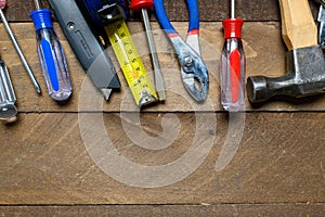 Working tools on wooden background