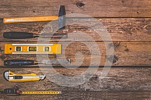 Working tools on wooden rustic background