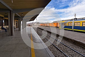 Working trains parked up at platforms at the Uyuni train station. Uyuni, Bolivia photo