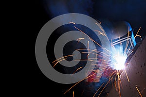 Working welder on black background