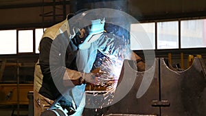 Working welder grinder works with metal structures