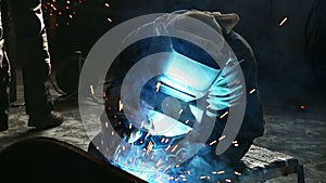 Working welder grinder works with metal structures