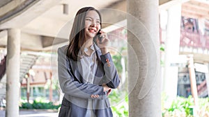 Working woman concept a working woman with smiley face speaking on the phone with her business partner