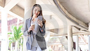 Working woman concept a young female manager attending video conference and holding a cup of coffee