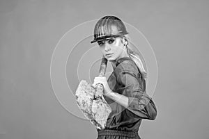 working woman. female builder hold shovel. building and construction.