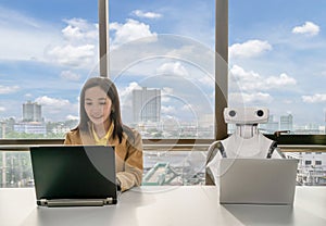 Working women and Robot computers in the office business RPA Robotic Process
