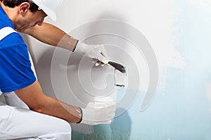 Workman Applying Plaster with Putty Knife