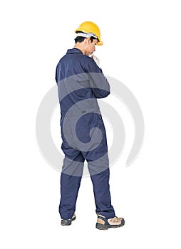 Workman with blue coveralls and hardhat in a uniform with clipping path