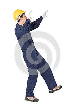 Workman with blue coveralls and hardhat in a uniform with clipping path