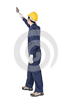 Workman with blue coveralls and hardhat in a uniform holding ste