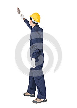 Workman with blue coveralls and hardhat in a uniform holding ste photo