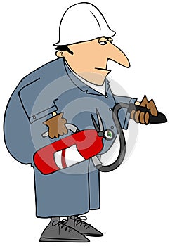 Workman in coveralls holding a fire extinguisher