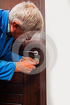 Workman fixing the door lock