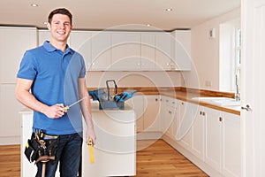 Workman Installing Beautiful Fitted Kitchen