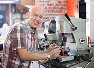 Workman making duplicates of keys