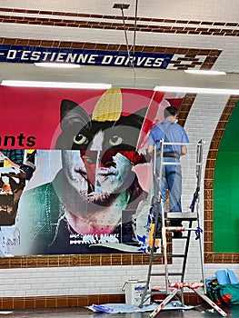 Workman inadvertently creates uncanny image in metro station, Paris, France