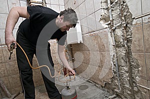 Workman renovating bathroom photo