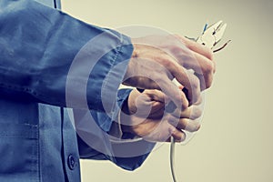 Workman repairing an electric cable