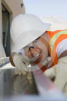 Workman Sighting Along A Beam photo