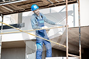 Workman warming building facade