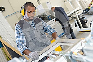 workman working at pvc windows factory