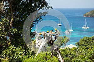 Tree cutters clearing electrical lines in preparation for a hurricane on a small island in the southern Caribbean
