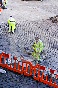 Workmen laying Cobbles