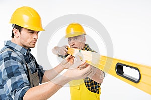 Workmen with level tool