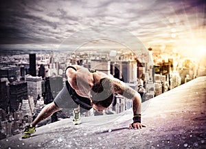 Workout above the roof of a building in the city