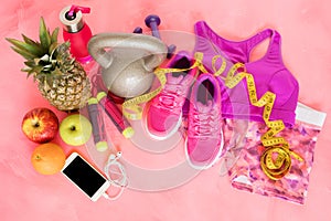 Workout equipment objects on pink floor photo