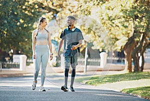 Workout, fitness and couple walk in nature together for wellness, bond and health in summer. Exercise and healthy