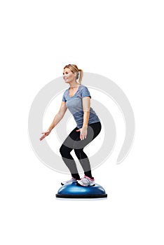 Workout, half ball and woman balance for wellness challenge, studio exercise or practice pilates on gym equipment