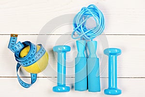 Workout and healthy lifestyle concept. Sports equipment in cyan blue