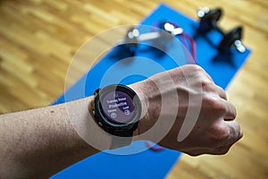 Workout at home. Close up shot of smartwatch which shows productive training. Sport watch shows info about workouts