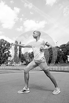 Workout of man punching sunny outdoor