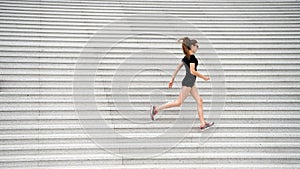 Workout outdoors. Energetic woman run stairs outdoors. Active life. Feel free. Freedom concept. Symbol of freedom