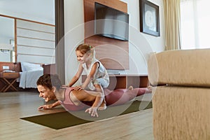 Workout. Parent And Child Exercising Together At Home. Happy Woman And Daughter Having Fun In Living Room.