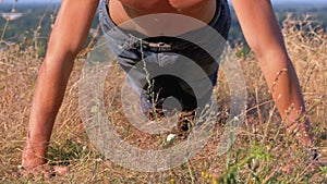 Workout. pushups fitness man doing push-ups outside on nature.