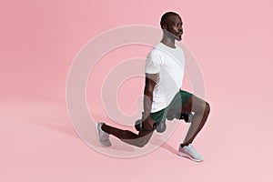 Workout. Sports man exercising, doing lunge with dumbbells