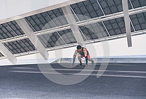 Workout urban outdoor concept. Hispanic Male athlete sprinter running, exercising pushups outdoors, jogging outside of