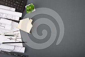 Workplace of architect - construction drawings, scale model and tools