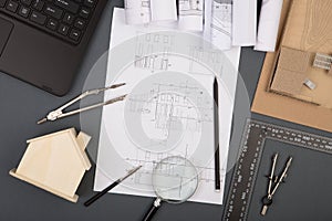 Workplace of architect - construction drawings, scale model and tools