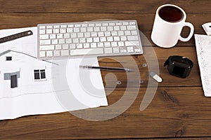 Architectural project, engineering tools on table.