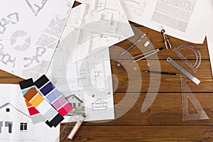 Architectural project, engineering tools on table.